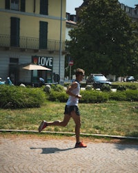 a man is running in a park