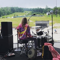 a person playing drums on a stage