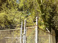 a chain link fence with a fire hydrant