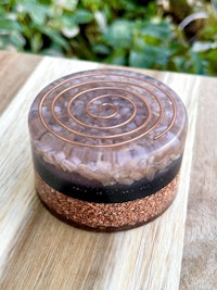 a glass container with a spiral design on it