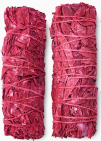 a pair of red sage sachets on a white background