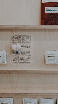 a wooden shelf with a variety of items on it