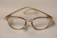 a pair of glasses with crystals on them
