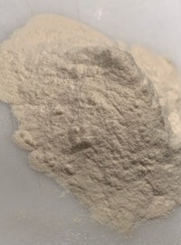 a white powder is sitting on top of a white surface