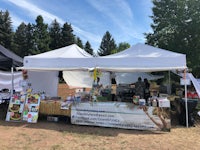 a tent with a table and books under it
