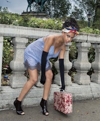 a woman holding a suitcase