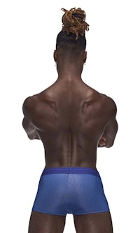 the back of a man wearing blue boxer shorts