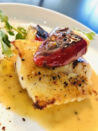 a plate of food with a sauce on it