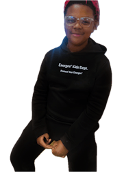 a young girl wearing glasses and a black hoodie