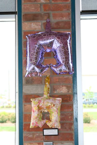 a group of balloons hanging on a wall