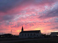 a church with a steeple in the background