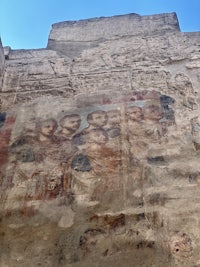 a painting on the side of a building with people on it