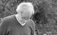 black and white photo of an older man with glasses