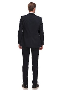 the back view of a man in a suit