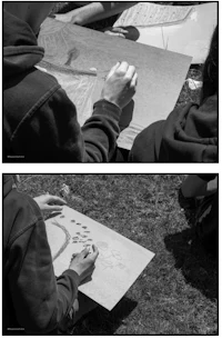 black and white photos of people drawing on paper