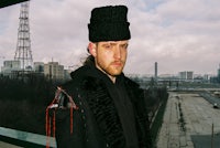 a man wearing a black hat