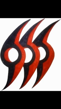 three red and black feathers on a white background