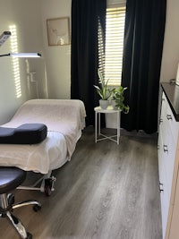 a small room with a chair and a desk