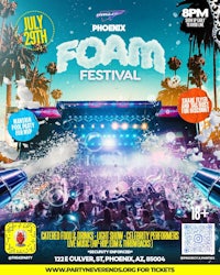 a group of people at a party with colorful lights