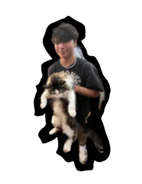 a young man holding a cat on a black background
