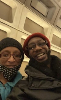 two people taking a selfie on an airplane