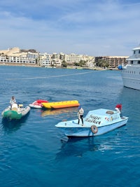 a group of people on a boat in the water