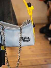 a purse with a chain attached to it