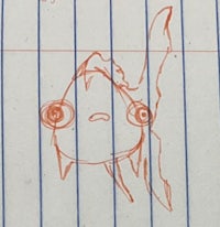 a drawing of a fish on a piece of paper
