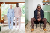 a man and a woman are posing in front of a kitchen