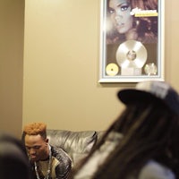 a group of people sitting on a couch in a room