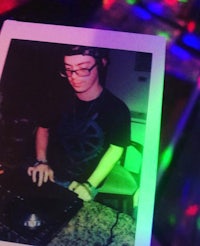 a photo of a man at a dj booth