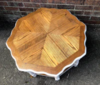 an octagonal coffee table with a white top