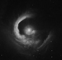 a black and white image of a spiral nebula