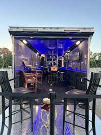 the inside of a mobile bar with blue lighting