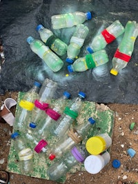 a pile of plastic bottles on the ground