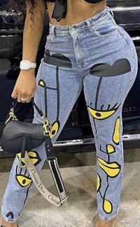 a woman is posing in a pair of jeans
