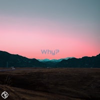 a pink sky with mountains in the background
