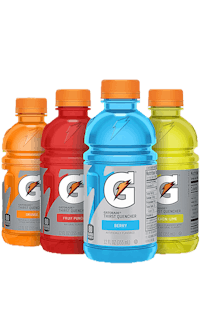 three bottles of gatorade on a black background