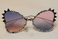 a pair of sunglasses with spikes on them