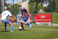 a group of men playing soccer on a field