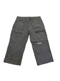 a pair of grey cargo shorts on a black background