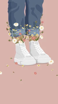 a pair of white sneakers with flowers in them