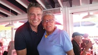 a man and woman posing for a photo at a restaurant
