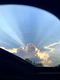 sunbeams through the window of a car