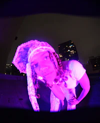 a woman wearing a purple hat