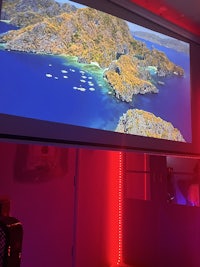 a room with a large screen showing a map