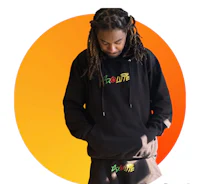 a man with dreadlocks wearing a black hoodie