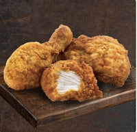 fried chicken on a wooden board