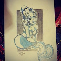 a drawing of a mermaid with long hair