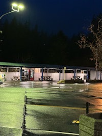 a parking lot at night with lights on